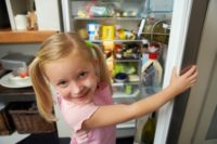 Girl at Open Refrigerator