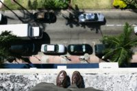 Man Standing on Edge of Roof