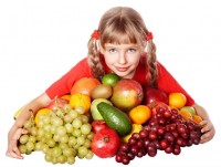Child girl with group of vegetable and fruit.